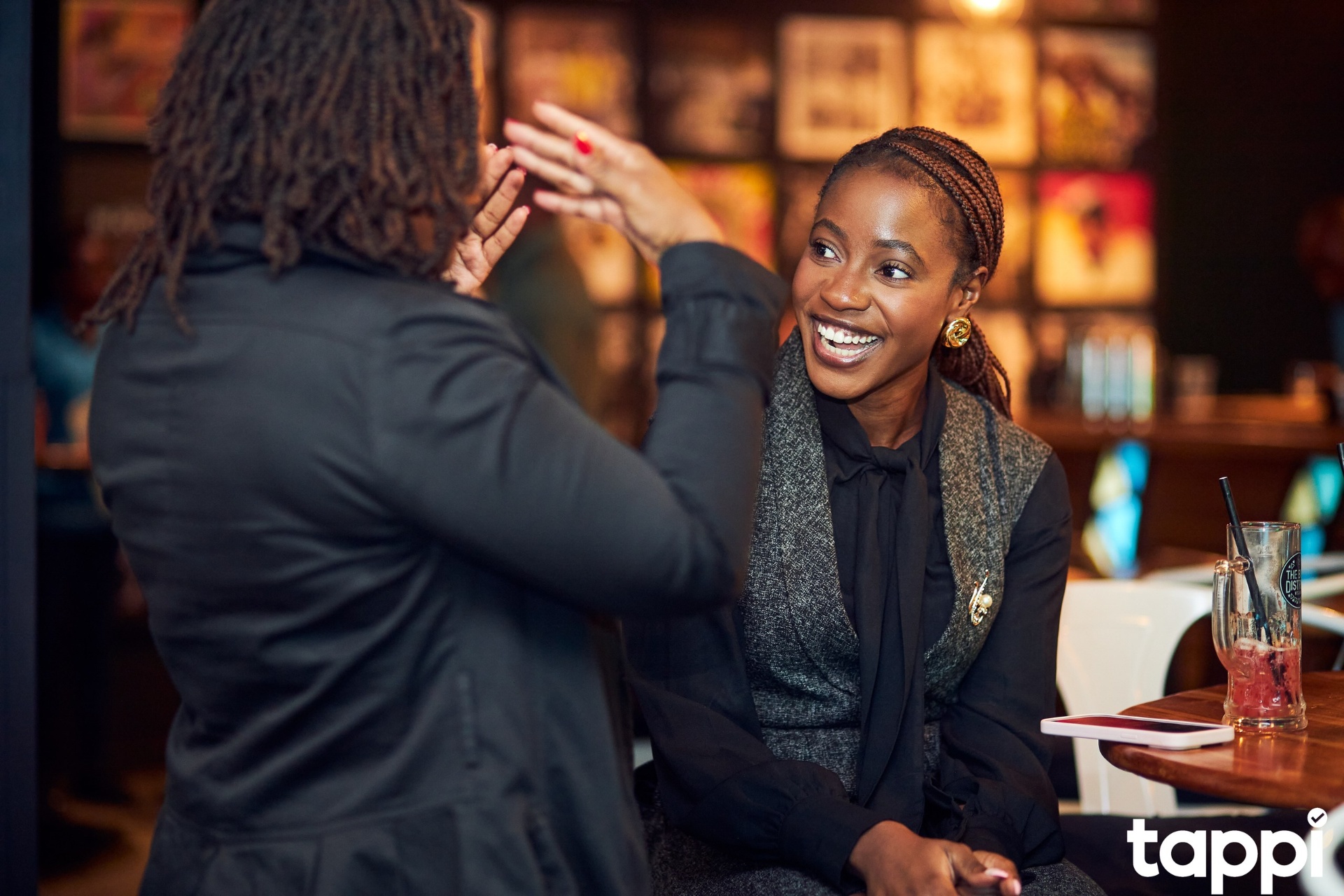 Two people sharing a laugh at a tappi event